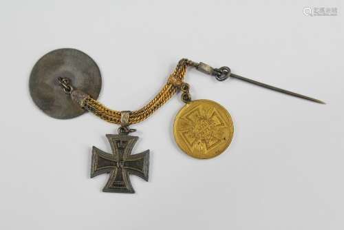 An 1870 Franco-Prussian Army Miniature Iron Cross, together with a miniature Franco-Prussian war medal and one other