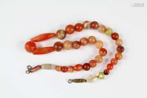 A String of Ancient Beads, including glass, carnelian and agate, approx 44 cms length