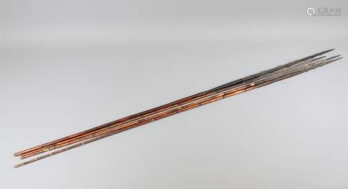 Four Antique Wahgi Valley Papua New Guinea Throwing Arrows: the arrows are flightless arrows used for the intimidation of humans, bamboo construction with barbed black palm tip, approx 120 cms