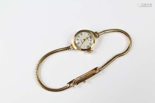 A 9ct Gold Yellow Gold Enka Lady's Cocktail Watch, on a 9ct gold bracelet, weight without movement, approx 7