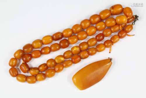 Butterscotch Amber Necklace, the beads range from 13mm to 28mm, approx 70 cms in length, approx 59 gms together with an amber pendant, approx 60mm x 28 mm