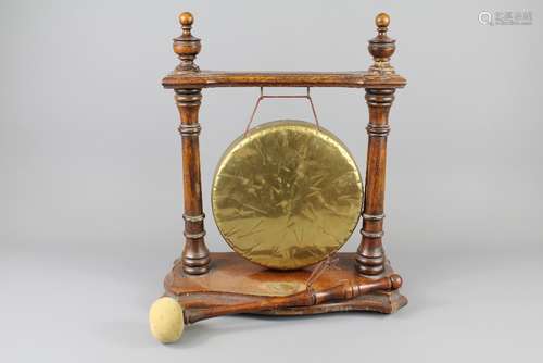 A 1930's Oak Framed Dinner Gong, approx 33 w x 38 cms h, with strike