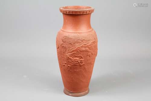 A Chinese Terracotta Vase; the vase having a raised chasing dragon design, approx 25 cms h unmarked