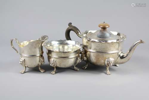 A Silver Tea Trio, comprises teapot, sugar bowl and milk jug, London hallmark, dated 1913, mm Edward Barnard & Sons Ltd, retailed by Garrard & Co Ltd, approx 1016 gms