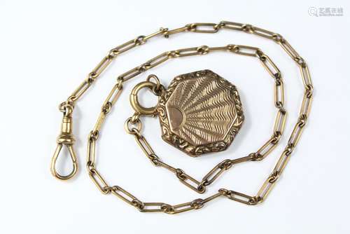 A 9ct Gold Shell Locket, suspended on a 9ct gold fob chain, approx 12