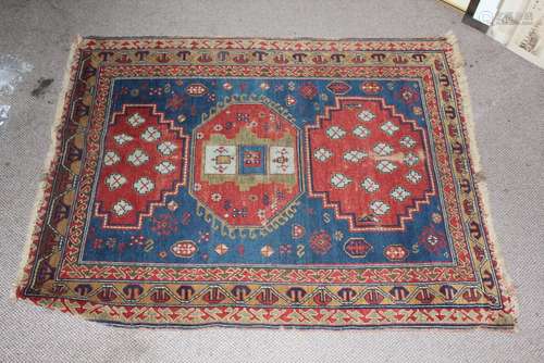 Antique Turkish Wool Carpet, approx 125 w x 150 l, with cobalt blue and red ground, three central gul, with geometric border, tassels and selvedges incomplete