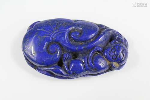 A Chinese Lapis Lazuli Carving, depicting a monkey clasping a blossom, approx 8 x 5 cms