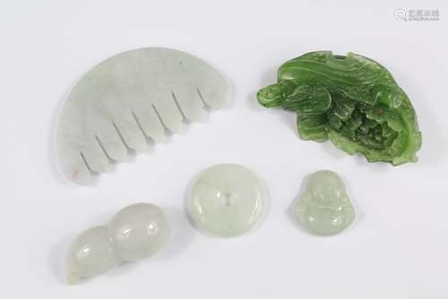 A Collection of Chinese Jade Carvings, this lot includes a green jade floral pendant, approx 5 cms l, white jade miniature comb together with three miniature white jade amulets