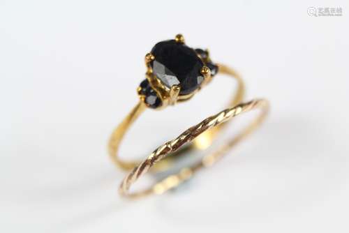 A 9ct Gold and Sapphire Ring; the ring together with a small wedding ring