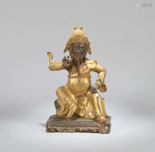 A CHINESE GILT BRONZE FIGURE JAMBHALA, QING DYNASTY