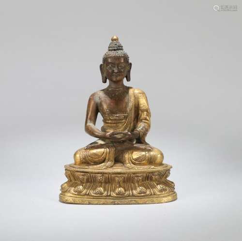 A CHINESE GILT BRONZE FIGURE SHAKYAMUNI, QING DYNASTY