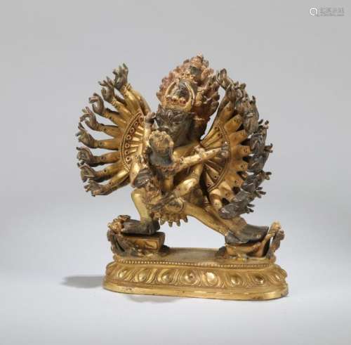 A CHINESE GILT BRONZE FIGURE GUARDIAN, QING DYNASTY