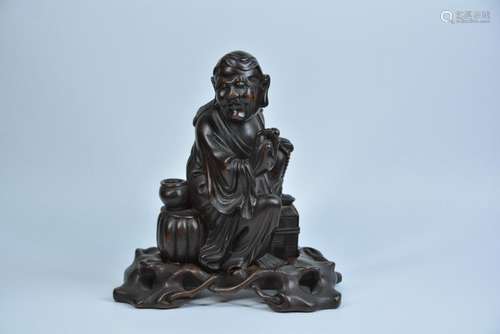 A CHINESE WOOD FIGURE OF LUOHAN, QING DYNASTY