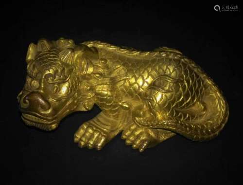 A CHINESE GILT BRONZE 'MYTHICAL BEAST' PAPER WEIGHT