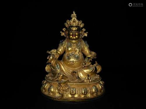 A CHINESE GILT BRONZE FIGURE OF JAMBHALA, QING DYNASTY