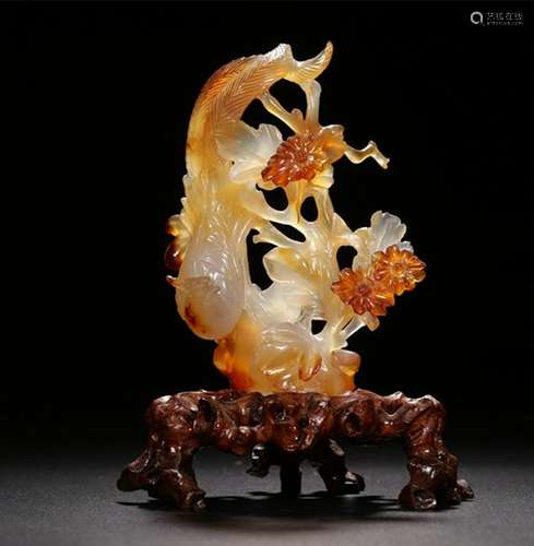 A CARVED AGATE PHOENIX .