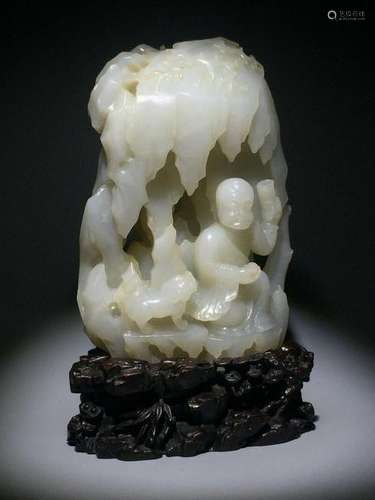 A CARVED WHITE JADE 'LUOHAN' BOULDER.QING PERIOD