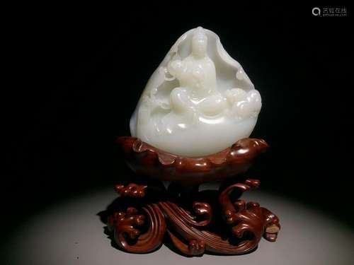 A WHITE JADE CARVING OF GUANYIN.