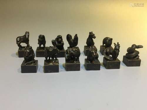 A SET OF TWELVE BRONZE ZODIAC. ANTIQUE