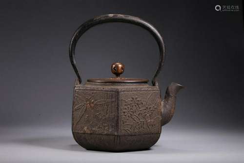 A SILVER-INLAID IRON TEAPOT. ANTIQUE