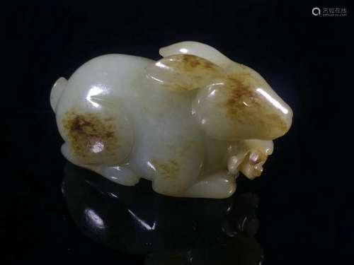 A CARVED WHITE JADE RABBIT .