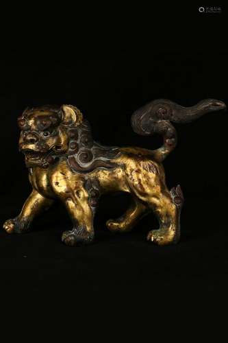 A GILT-BRONZE FIGURE OF LION.QING PERIOD