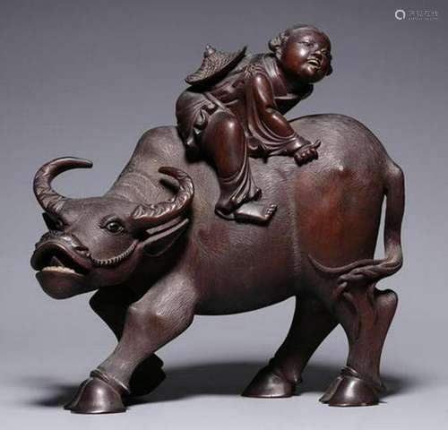 A CARVED ROSE WOOD BOY AND ELEPHANT.QING PERIOD