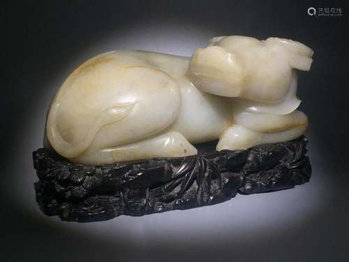 A CARVED WHITE JADE BUFFALO.QING PERIOD