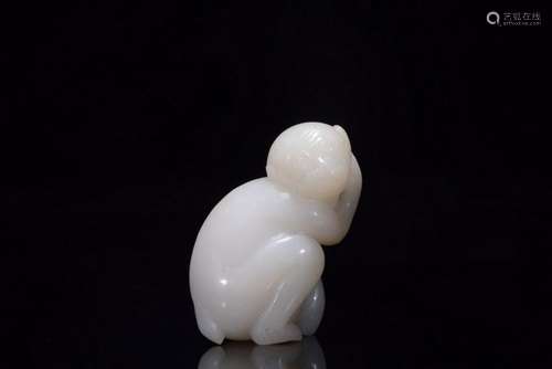 A CARVED WHITE JADE MONKEY.QING PERIOD