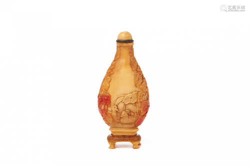 A CARVED HORNBILL SNUFF BOTTLE, WITH ITS STAND