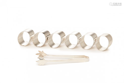 SIX STERLING SILVER NAPKIN RINGS, WITH A TONG