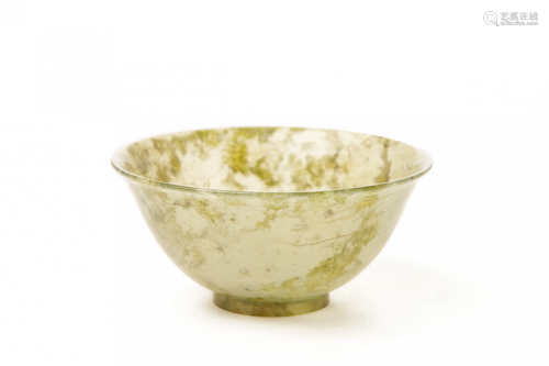 A CARVED TRANSLUCENT NEPHRITE/SERPENTINE STONE TEA BOWL