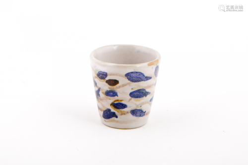 A SMALL POTTERY POT WITH BLUE FISHES
