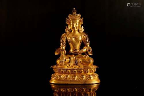 A gilt-bronze figure of green tara