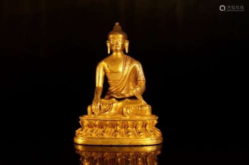 A gilt-bronze figure of buddha shakyamni
