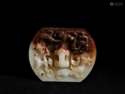A white jade carving of people and animals
