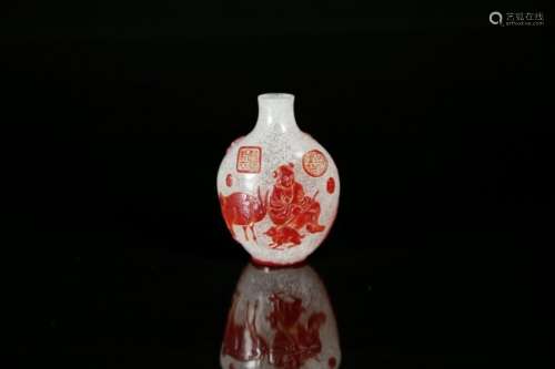 A carved red glass overlay snuff bottle