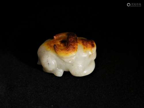 A white jade figure of cattle