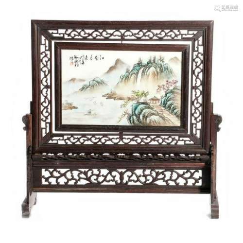 Framed Chinese landscape painted on porcelain.