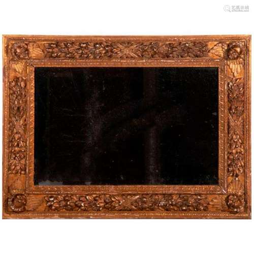 An 18th century carved giltwood mirror.