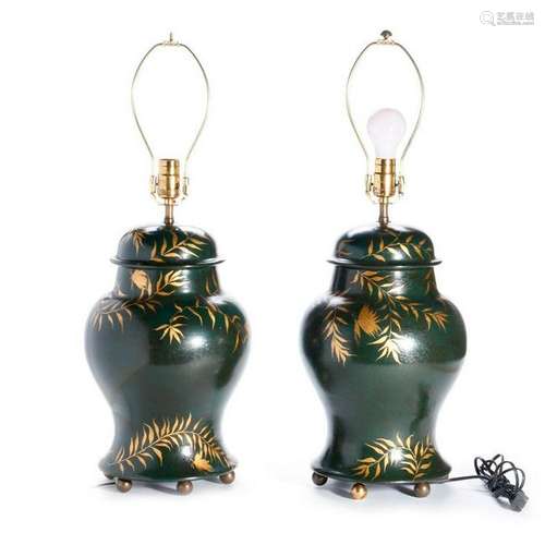 Pair of green and gilt painted lamps.