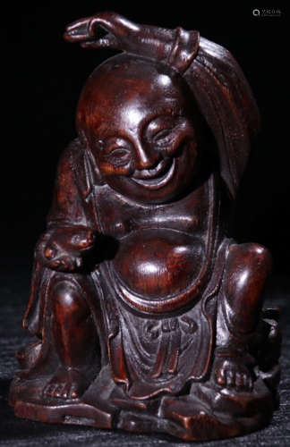 A CHENXIANG WOOD CARVED CHILD SHAPED PENDANT