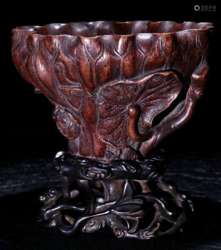 A CHENXIANG WOOD CARVED LOTUS PATTERN CUP