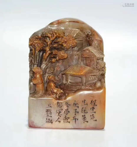 A SOAPTONE CARVED MOUNTAIN SHAPED SEAL