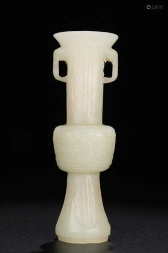 A HETIAN JADE CARVED BEAST PATTERN GU VASE