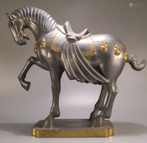 A TIN CARVED HORSE SHAPED ORNAMENT