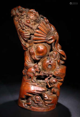 A BAMBOO CARVED FIGURE SHAPED PENDANT