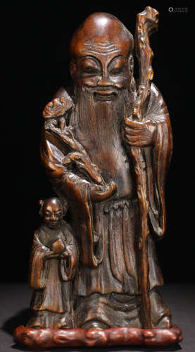 A CHENXIANG WOOD CARVED FIGURE SHAPED PENDANT