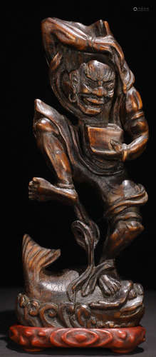 A CHENXIANG WOOD CARVED FIGURE SHAPED PENDANT