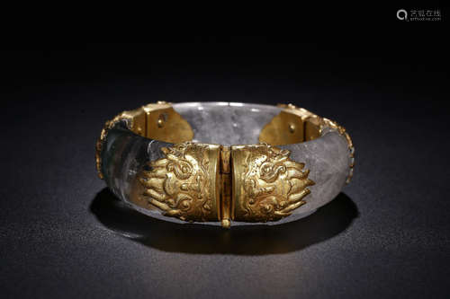 A CRYSTAL WRAPPED GOLD BANGLE WITH DRAGON PATTERN